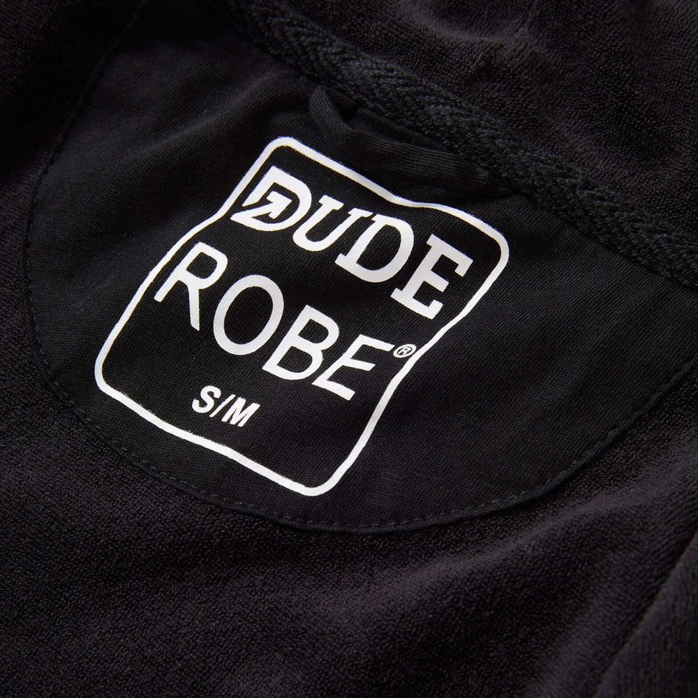 IndoorCamo™ Limited Edition DudeRobe logo showcased on a black fabric, representing style and comfort.