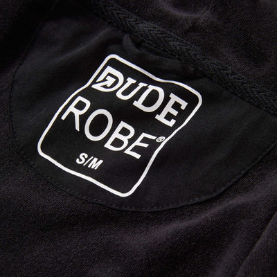 IndoorCamo™ Limited Edition DudeRobe logo showcased on a black fabric, representing style and comfort.
