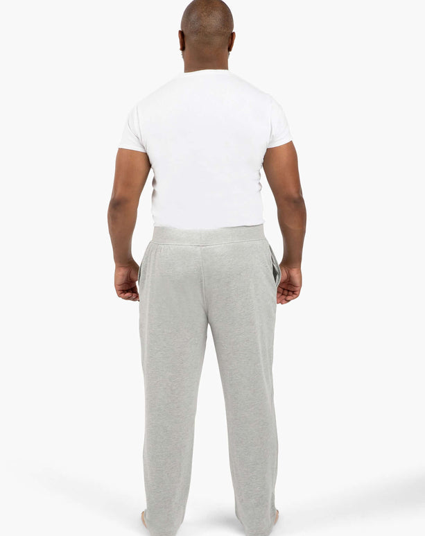 Back view of a man wearing DudePants, featuring absorbent towel lining and relaxed leg holes for ultimate comfort.