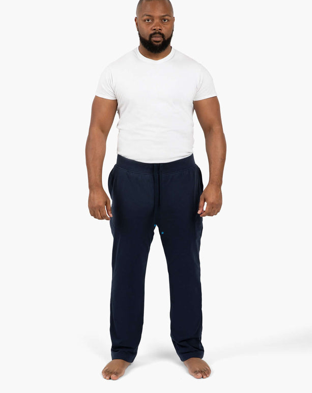 Active dude wearing DudePants: comfy absorbent sweatpants perfect for gym, beach, or chill time.