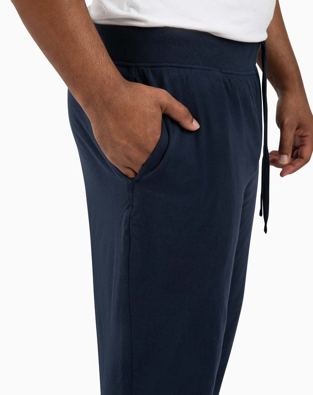 DudePants side view showing deep pockets, relaxed leg holes, and comfy waistband for active lifestyles.