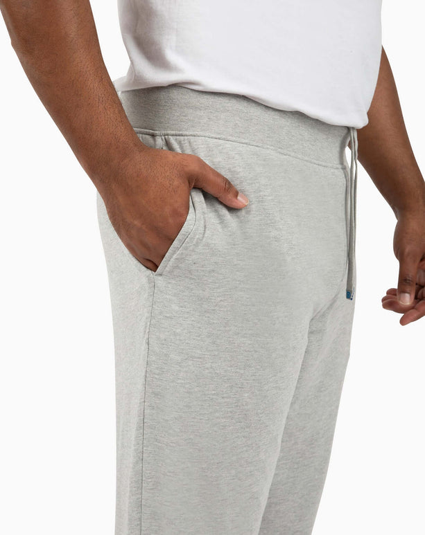 Side view of DudePants with relaxed leg holes and deep pockets, showcasing their comfort and sporty style.