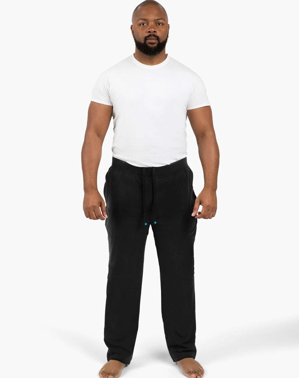 Active dude in DudePants: comfy, absorbent sweatpants for gym, beach, and chill activities.