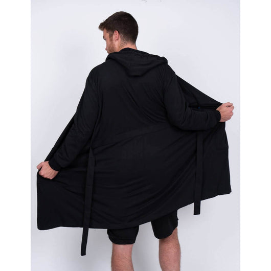 A person wearing the UFC DudeRobe in black, showcasing its comfortable design, perfect for UFC fans and fight nights. UFC merch.