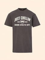 Just Chillin' Indoor Athletic Dept. tee in Ash Black with a cream couch crest print on the chest