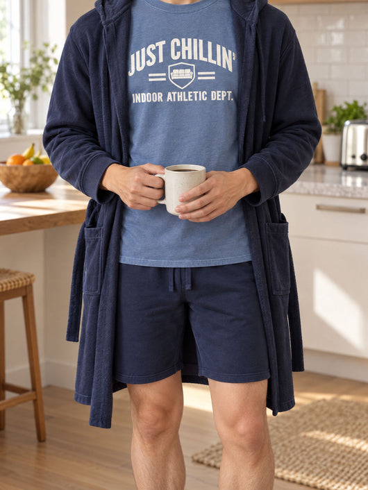 Just Chillin' tee in Oxford Blue worn under an open navy DudeRobe in the kitchen
