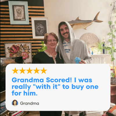 Grandma proudly poses with her grandson wearing an american flag robe, showcasing family moments and comfort wear.