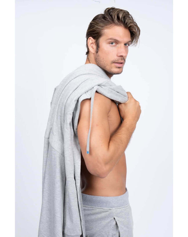 Stylish man showcasing a luxury men's bathrobe and pants combo, designed for comfort and modern appeal.