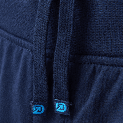 The Pants premium logo'd drawstrings on navy men's sweatpants with comfortable waistband.