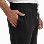 Close-up of a man wearing men's shorts with a hand in the pocket showing comfort and style.
