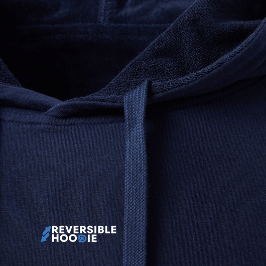Close-up of a navy reversible hoodie for men showcasing soft fabric and hood design.