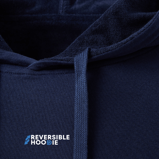 Close-up of a navy reversible hoodie for men showcasing soft fabric and hood design.