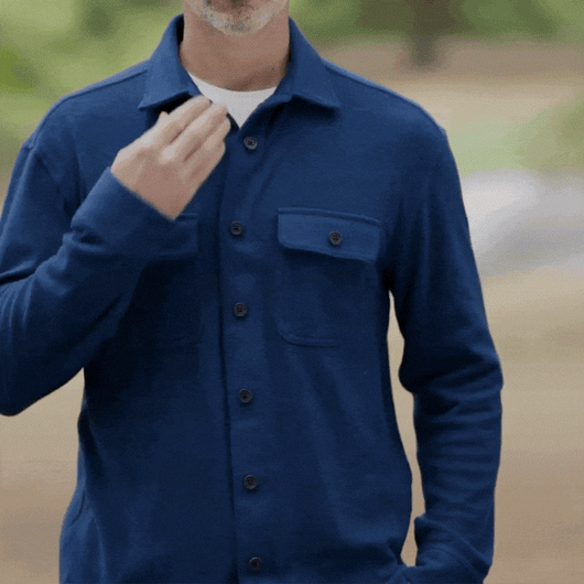 Model wearing The 1-Second Flannel magnetic button shirt in blue, showcasing innovative magnetic shirts design.