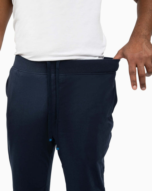 Model showcasing DudePants with a relaxed fit and premium waistband, perfect for active lifestyles and comfort.