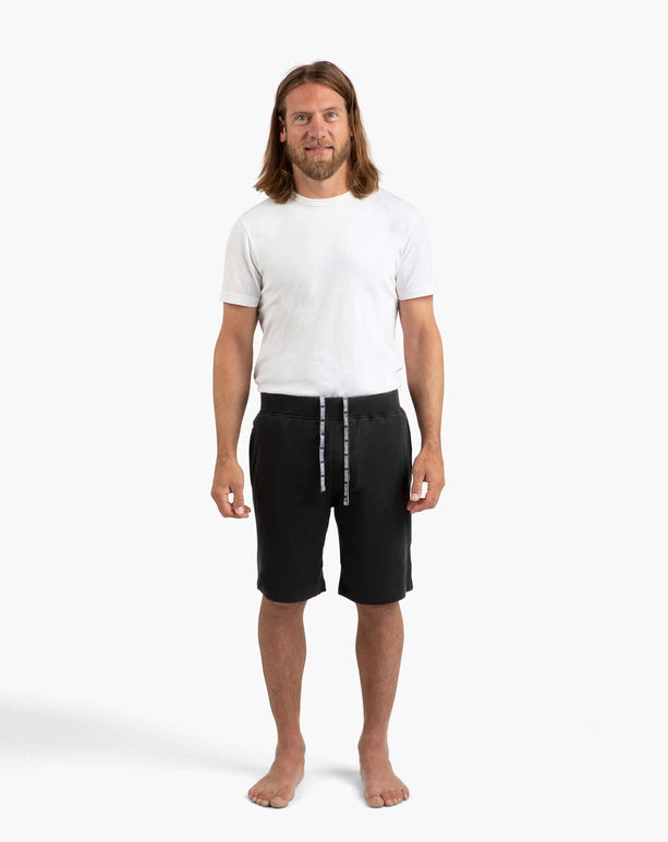 Man wearing DudeShorts, showcasing premium comfort and absorbent towel lining, perfect for active lifestyles.