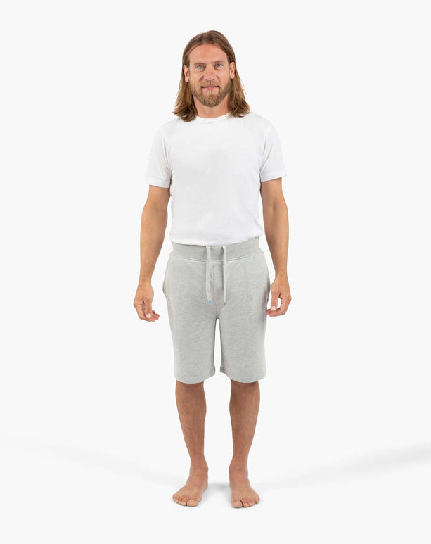 DudeShorts model showcasing premium comfort shorts with absorbent towel lining, perfect for gym, beach, and everyday wear.
