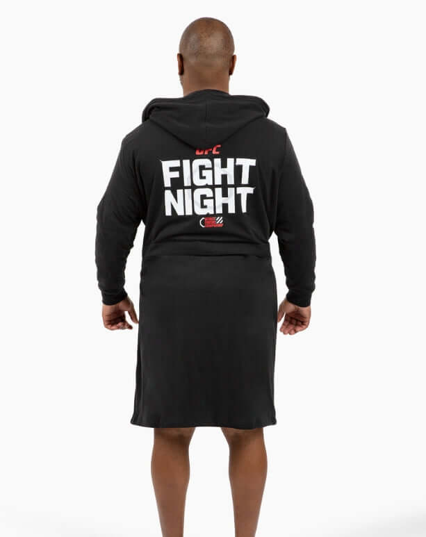 Man wearing UFC DudeRobe in black, showcasing the back design reading 'FIGHT NIGHT'.