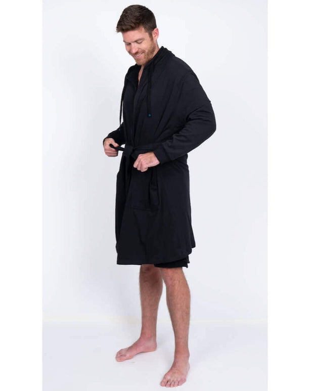 Man wearing a black DudeRobe, showcasing modern design for lounging and casual wear.