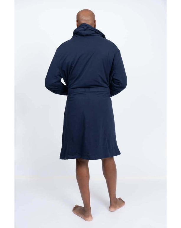 Man wearing a luxury hooded DudeRobe bathrobe, showcasing the modern design and comfort for lounging.