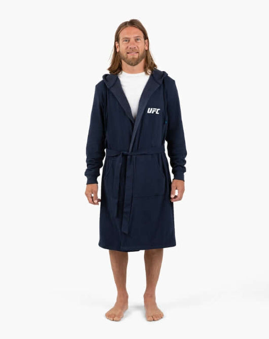 Man wearing a UFC DudeRobe in navy, showcasing this comfortable UFC merch. Perfect for fight night.