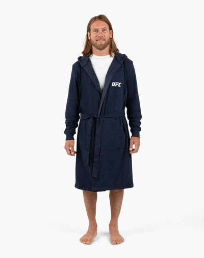 Man wearing UFC DudeRobe - Navy with hood, perfect for lounging or post-shower comfort.