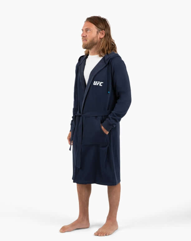 Man wearing UFC DudeRobe in navy, stylish and comfortable, perfect for lounging and chilling at home.